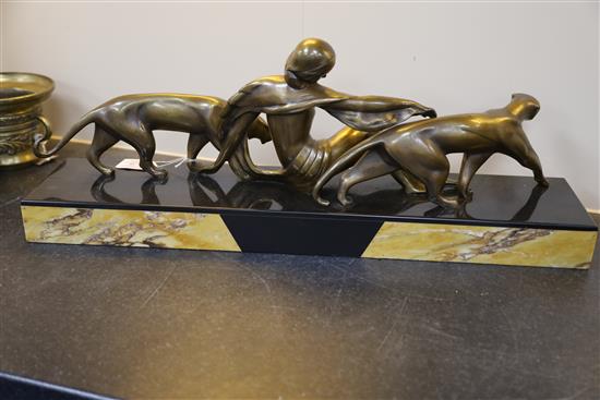 Michel Decoux (1837-1924). An Art Deco bronze group of a reclining woman with two panthers, 22.75in.